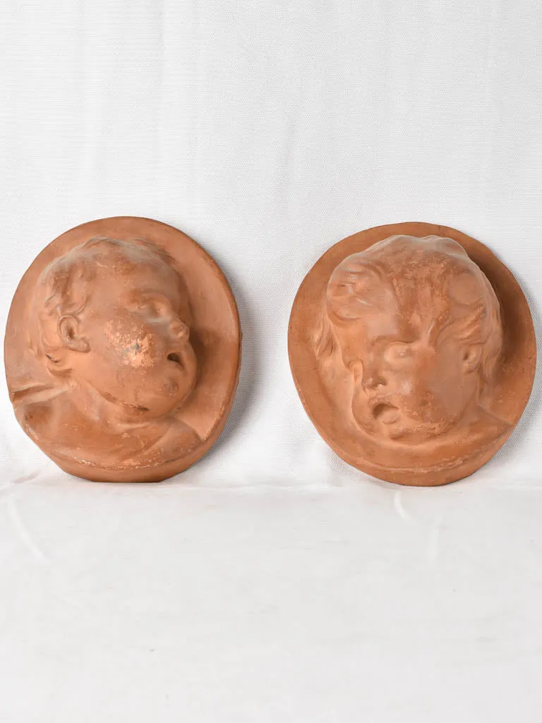 2 cherub wall sculptures Atelier Prome?the?e - terracotta 10¼"