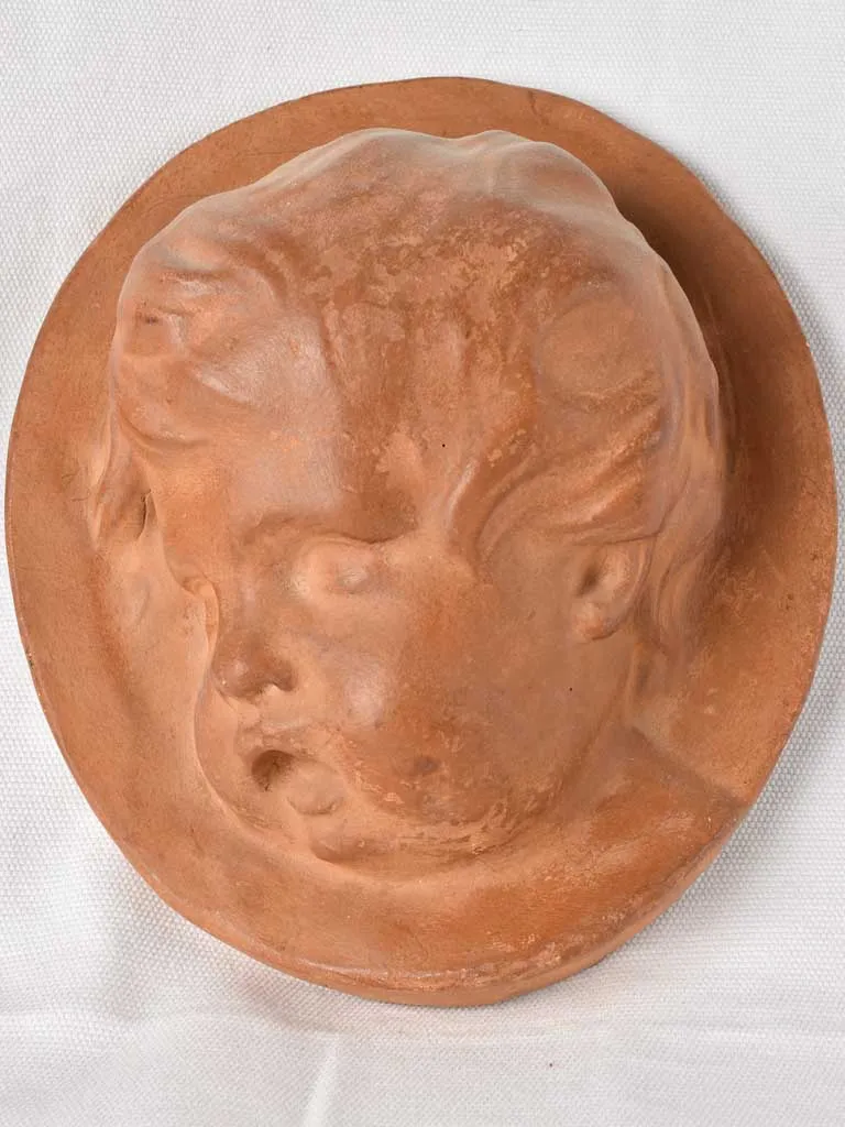 2 cherub wall sculptures Atelier Prome?the?e - terracotta 10¼"