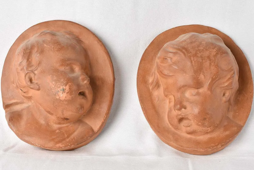 2 cherub wall sculptures Atelier Prome?the?e - terracotta 10¼"