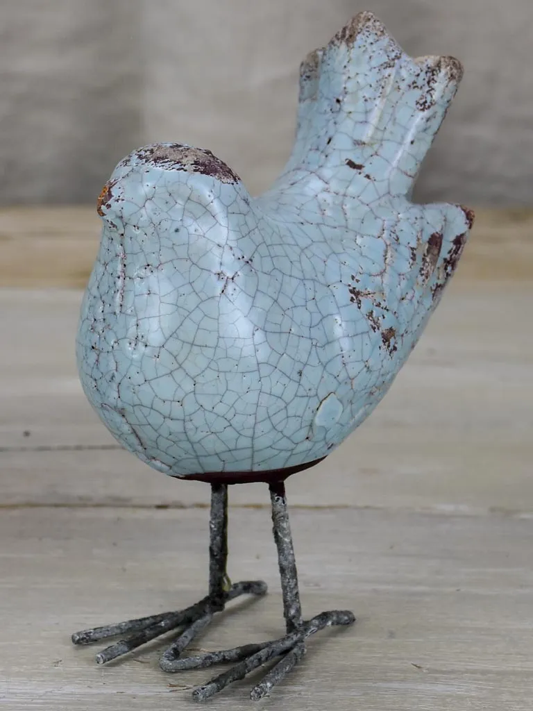 Two artisan made bird sculptures