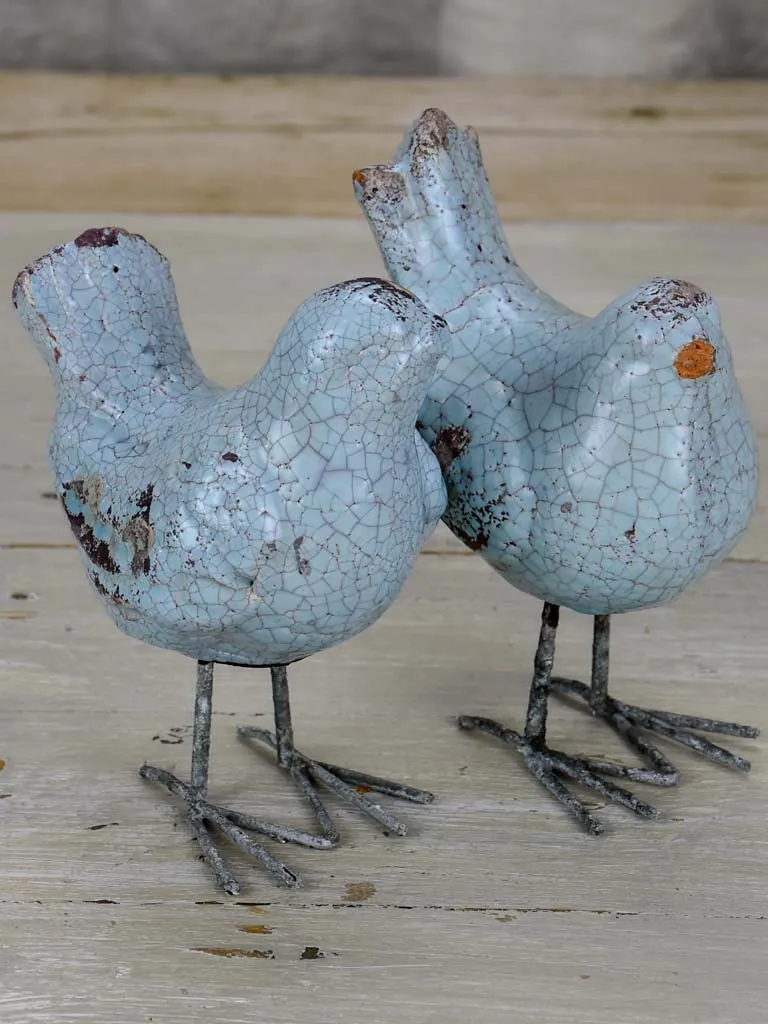 Two artisan made bird sculptures